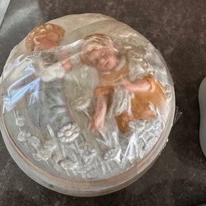 Vintage Avon "Golden Dreams" porcelain musical trinket box.